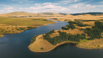 Aerial view of  of Zlatibor's lake nestled rolling meadows