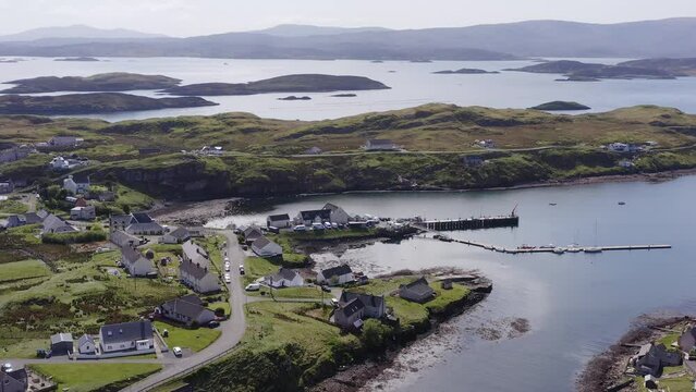 Aerial shot of the Isle of Scalpay, an island near the Isles of Harris and Lewis on the Outer Hebrides of Scotland. The Minch sea is visible in the background.