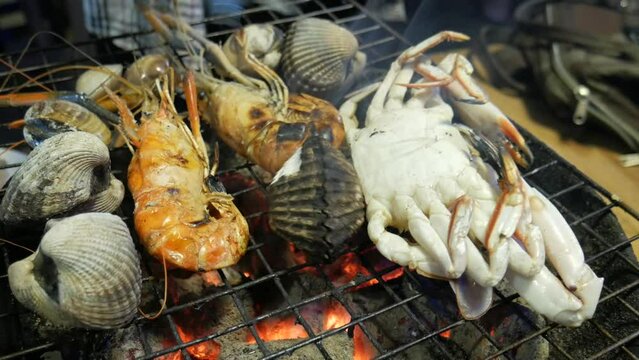 seafood grill on hot charcoal at bangkok seafood restaurant