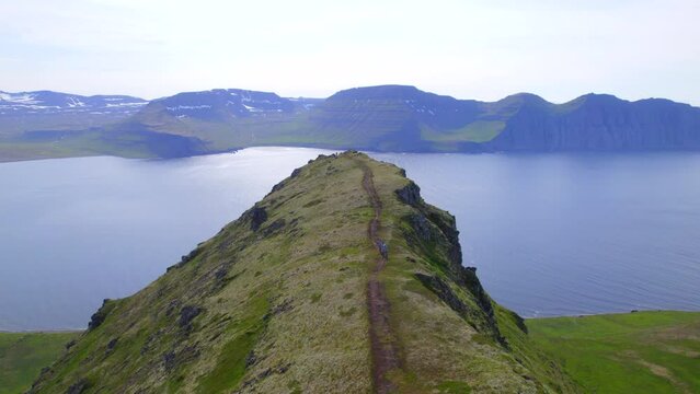 Epic Drone Flight over people hiking on a Ridge in the remote Hornstrandir nature reserve- Westfjords, Iceland