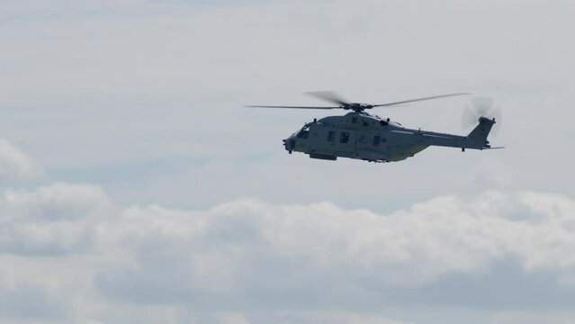 Military Transport Helicopter Flying on a Sunny Day Profile View TRACK