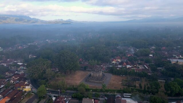 Aerial high angle view of stone monument of Mendut Temple. Ancient Buddhist Temple in Magelang, Indonesia - 4K drone shot
