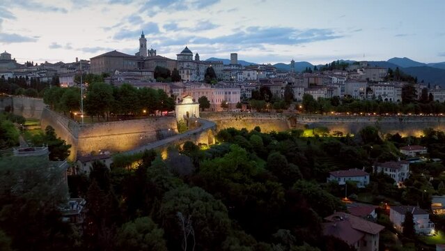 Italy, Bergamo alta at dusk general aerial vison
lights on 