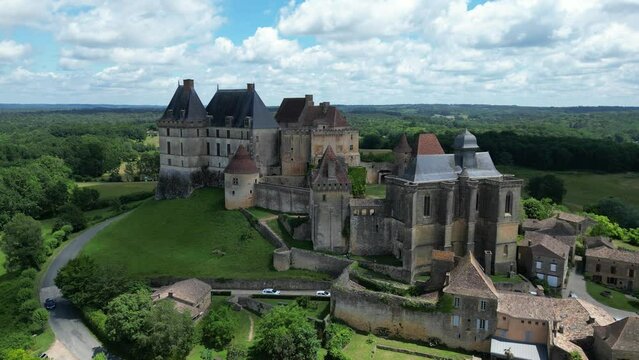 Panning aerial Biron castle Chateau Dordogne France
