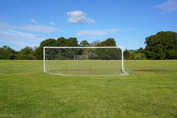 soccer field in public park. Recreational football pitch with goal nets. sports and fitness backdrop 