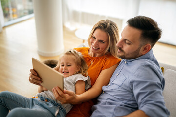 Obraz premium Device technology family online education concept. Happy family with digital devices at home.