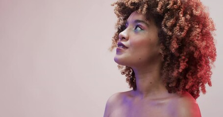 Biracial woman with dark hair in blue and pink light with copy space, slow motion - Powered by Adobe