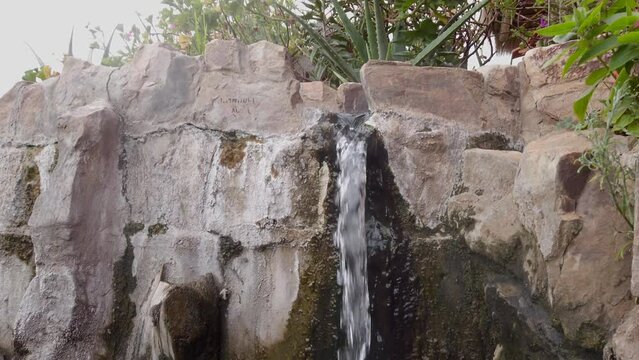 Small Spring Waterfall Of Banos del Inca At The Center Of Cajamarca In Peru. Tilt-up