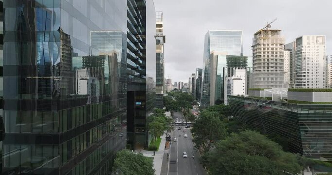 Aerial rising next to Patio Victor Malzoni Building on cloudy day, Sao Paulo, Brazil
