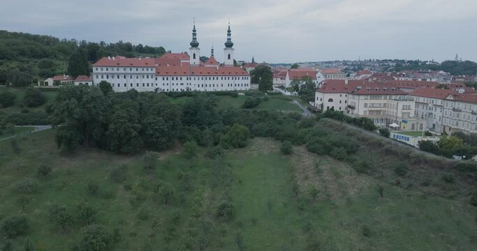 Aerial Drone Shot Prague Czech Republic Strahovsky Klaster Mala Strana Cloudy at Sunset