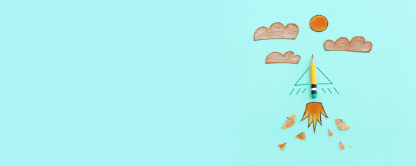 Concept image of pencil as rocket metaphor on blue background