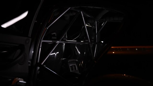 Safety cage detail shot in a professional racing car at night
