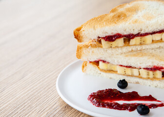 peanut butter and jelly sandwich with banana and fresh blueberry