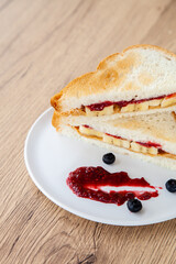 peanut butter and jelly sandwich with banana and fresh blueberry