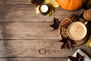 Autumn background with coffee and pumpkin