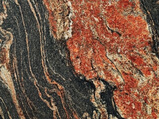 Marble texture background grain textured surface black and red orange color. Vintage style stone plate marbling wallpaper. Elegant royal design for print projects