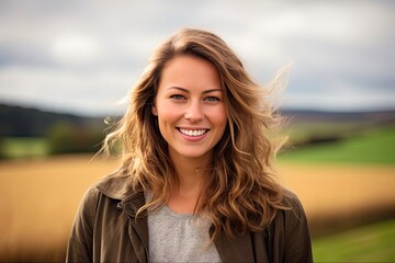 Chic Woman in Her 30s Grinning in Countryside Portrait Photography Group Shot. Genuine Emotions and Expressions of Female Adult Happiness - obrazy, fototapety, plakaty