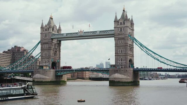 view of Tower Bridge from the side of the river in London, UK