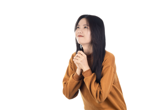 Young Asian woman holding hands in prayer, asking for help, expressing gratitude isolated on white background with clipping path.