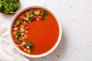 Spanish tomato gazpacho cold soup styled and decorated in white plate