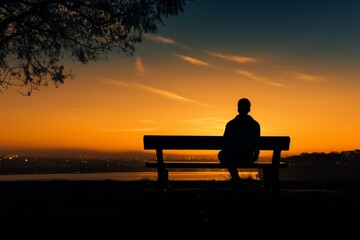 Obraz premium Calm twilight, Silhouetted man sits on bench during peaceful sunset