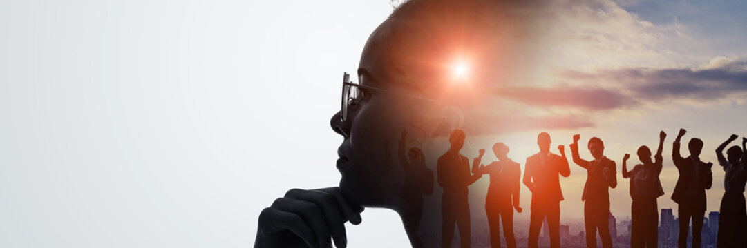 Thinking Black woman and teamwork concept. Wide angle visual for banners or advertisements.