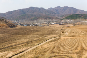 Village and collective farm barracks, between Myohwangsan and Pyongyang, North Korea