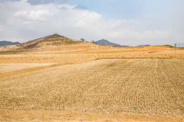 North Korea, near Pyongyang, poor and dry countryside, at the end of winter