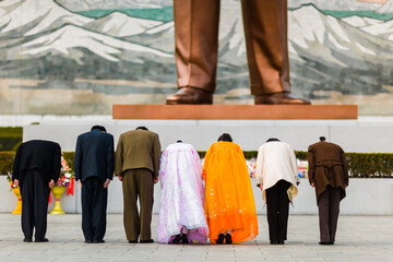 PYONGYANG, NORTH KOREA : young couples pay respect to Kim Il-Sung giant statue in Mansudae Grand Monument