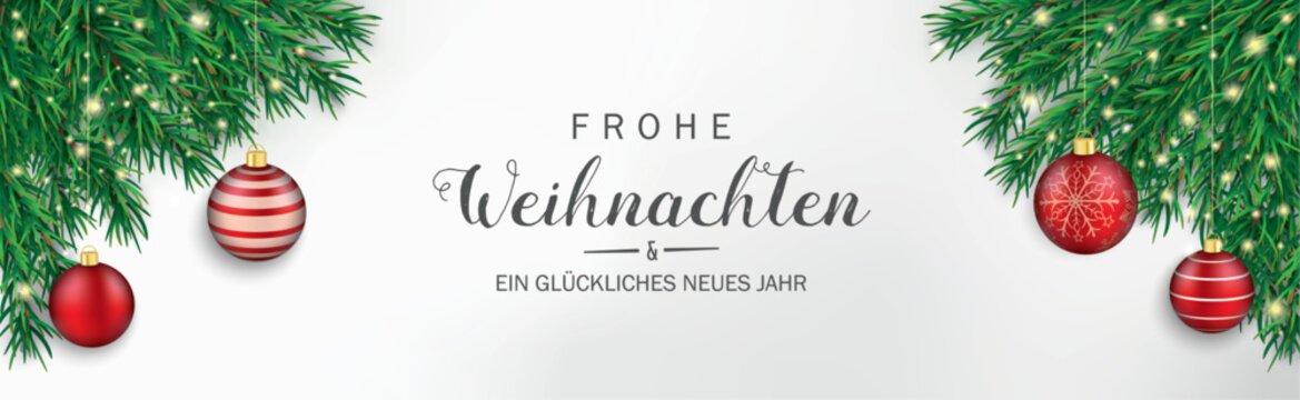 Frohe Weihnachten Banner mit gr&uuml;nen Tannenzweigen und roten Weihnachtskugeln