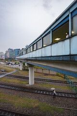Fototapeta na wymiar YONGSAN, SEOUL, SOUTH KOREA: suspended corridor, above railway tracks, leading to Yongsan Electronic Market