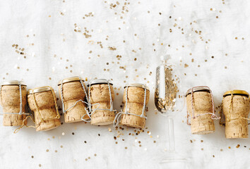Top view New Year, xmas concept, row wine corks from sparkling wine and Christmas bauble champagne...