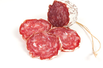 pile of red salami, on a white