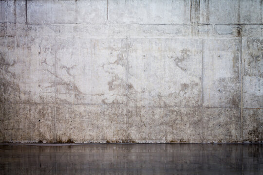 Grungy and smooth bare concrete wall