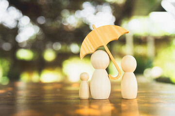 Umbrella icon and family model, Security protection and health insurance. The concept of family home, protection, health care day, car insurance.	