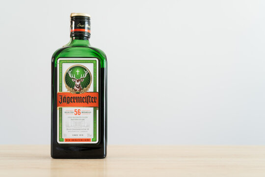 J&auml;germeister glass bottle. German digestive alcohol drink. Jagermeister digestif herbal liqueur made with 56 herbs and spices. Composition with copy space on August 20, 2023 in Miekinia, Poland.
