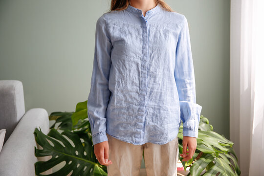 The woman wore a rumpled shirt.