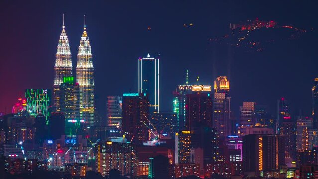 Time-lapse footage of Kuala Lumpur cityscape with Genting Highland visible at the background