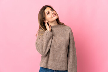 Young slovak woman isolated on pink background thinking an idea