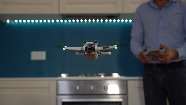 Real estate home shooting with drone - professional photographer use drone to take photos and video of the house to sell - real estate agency takes over the interior of the house 