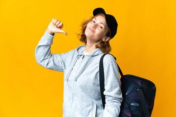 Young sport Georgian woman with sport bag over isolated background proud and self-satisfied