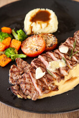 Striploin angus steak with mashed potato and grilled vegetable