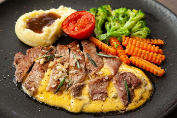 Striploin angus steak with mashed potato and grilled vegetable