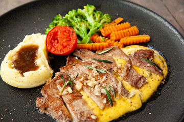 Striploin angus steak with mashed potato and grilled vegetable