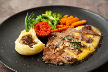 Striploin angus steak with mashed potato and grilled vegetable