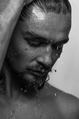 Beautiful male studio portrait with water