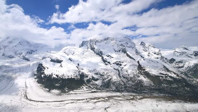 View train station with tourists and Matterhorn summit and Gorner Glacier in Switzerland