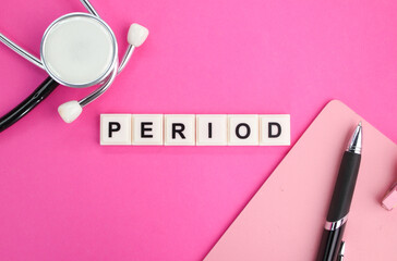 stethoscope, pen and alphabet letter with word period. the concept of pregnancy or menstruation. the concept of women's disease