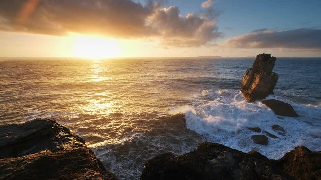Ocean cliff rock by the sea at sunset in Cabo Carvoeiro, Peniche, Portugal