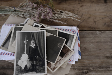 black old family photos, stack of old family vintage photographs of 50s, 40s, letters envelopes on...